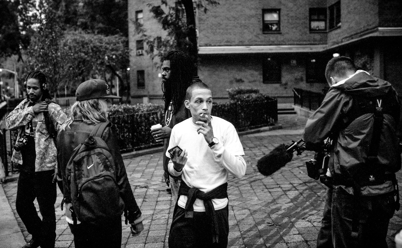 Copwatch. Men with cameras. Man smoking cigarette. Black and white photo. Krull magazine