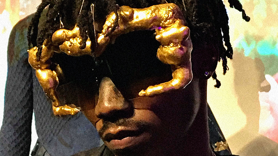 black model with dreads wearing sunglasses by Jerome Lamaar