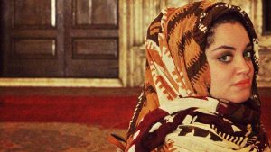 Egyptian woman in head scarf in ornate building