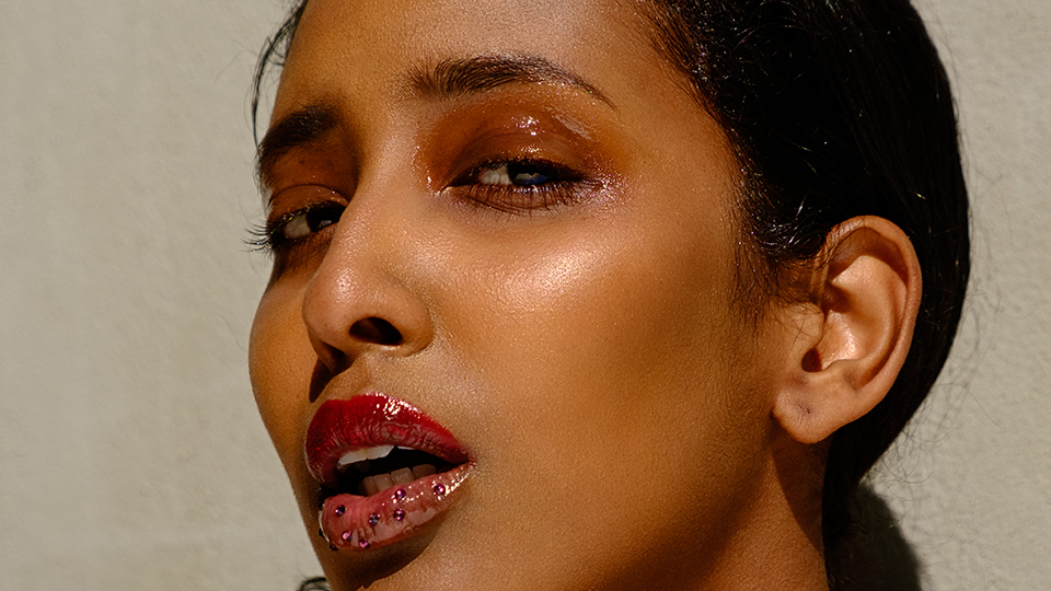 closeup photo of model in glossy makeup