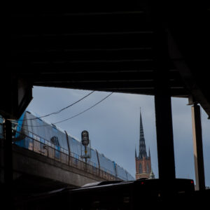 Stockholm tunnelbana coming into Slussen. Riddarholmskyrka in background.