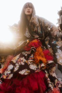 Krullmag. Designer Louise Xin in couture dress in Paris