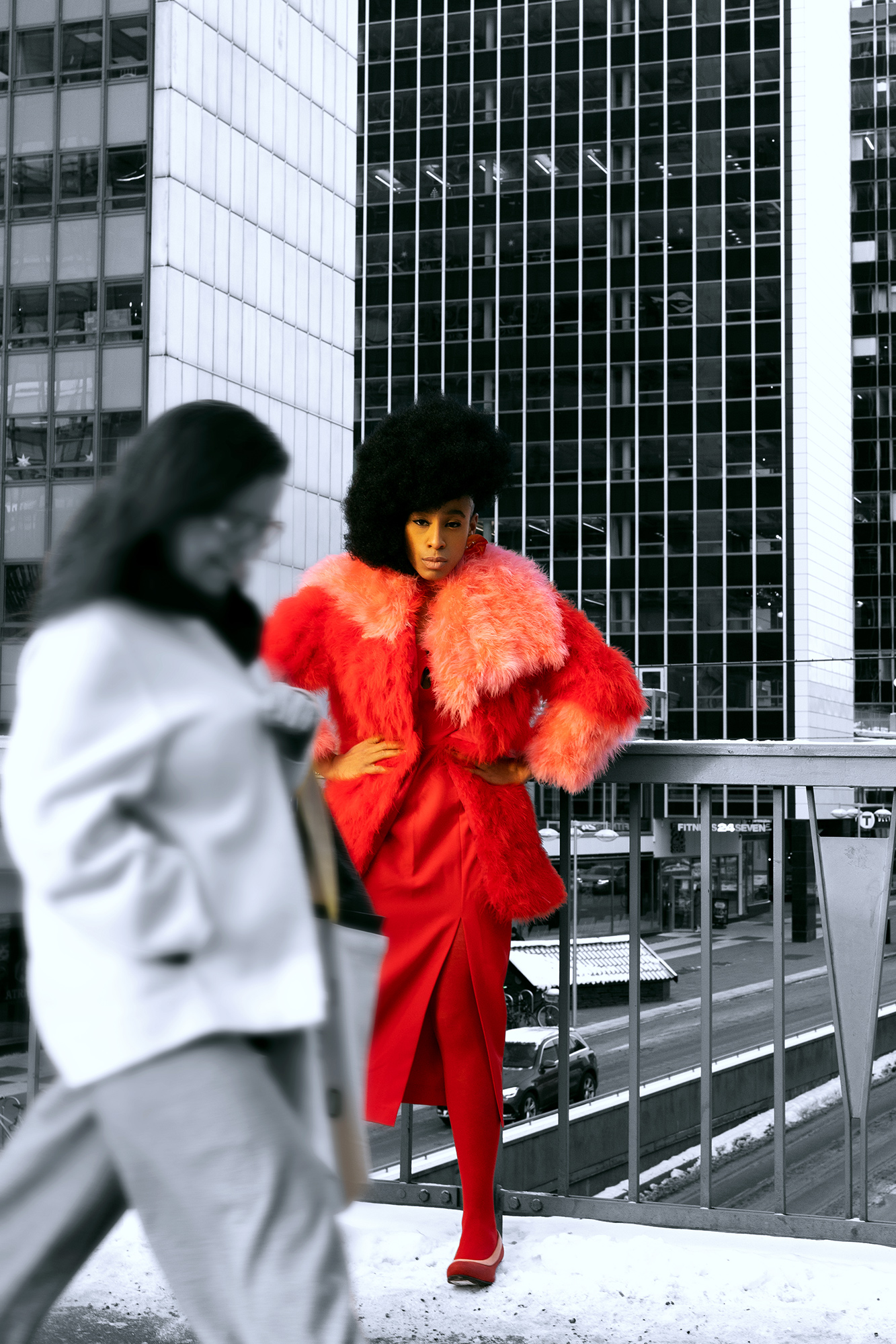 krullmag, shocking red fur coat against gray cityscape