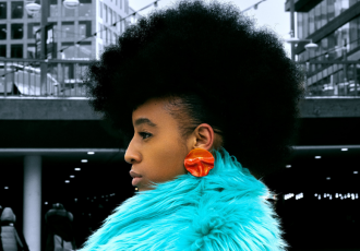 krullmag, black model coral earrings turquoise fur coat