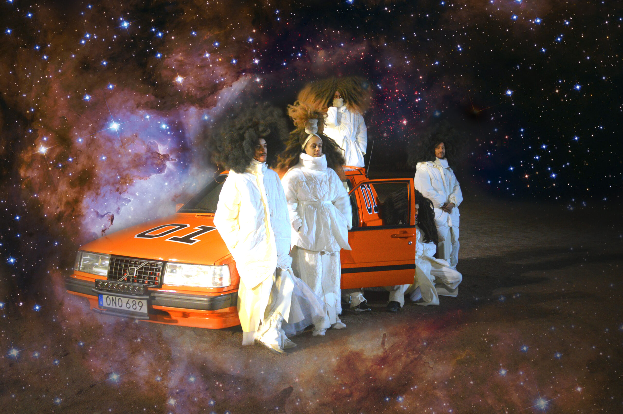 FutureBrownSpace performers in white costumes beside a red car, composited against a star-filled background.